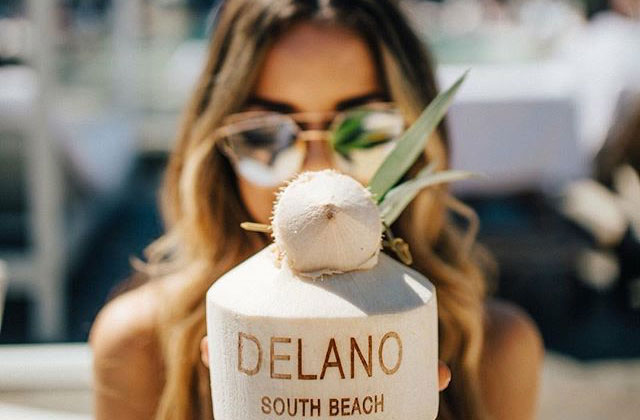Woman with drink Delano Beach Club