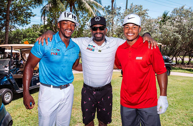 Dj irie posing with friends