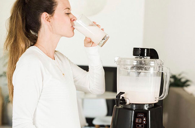 Woman drinking nut milk